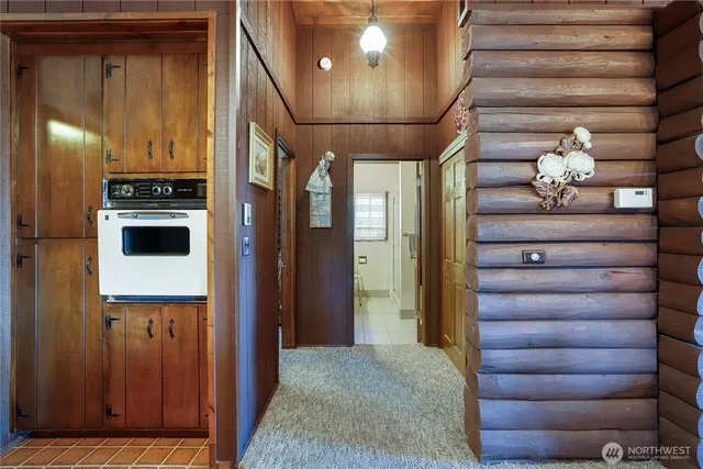 a view of a hallway with washer and dryer