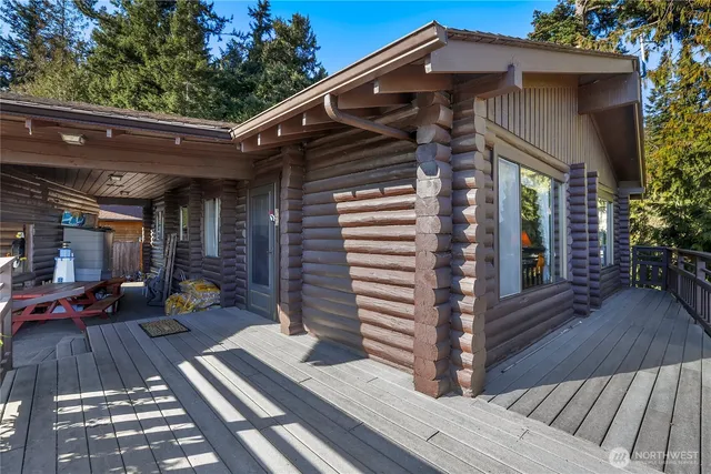 a front view of a house with outdoor seating