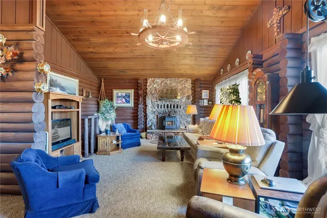 a view of a livingroom with furniture and a fireplace
