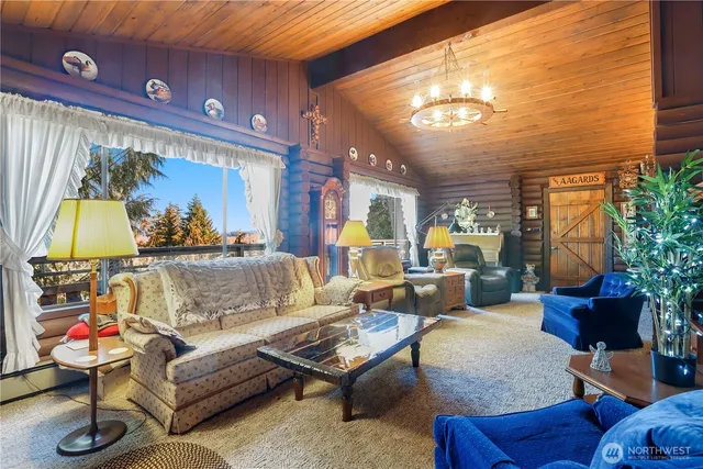 a living room with furniture and a lamp