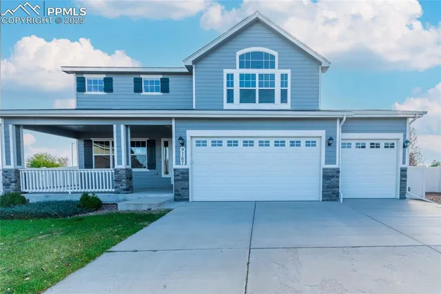 a front view of a house with a garage