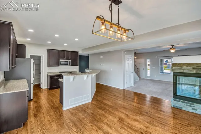 a kitchen with a sink and a stove