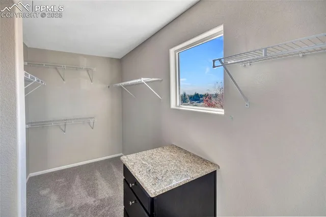 a spacious bathroom with a tub sink and mirror