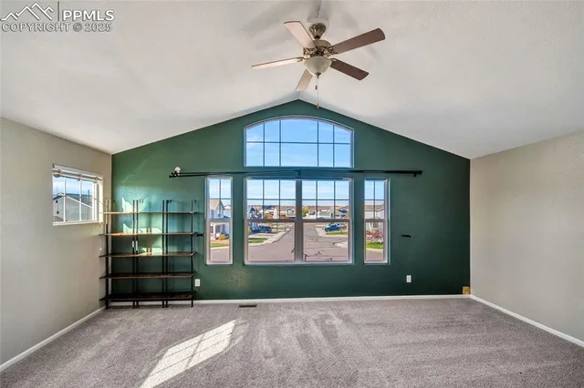 a spacious bathroom with a granite countertop sink and a mirror