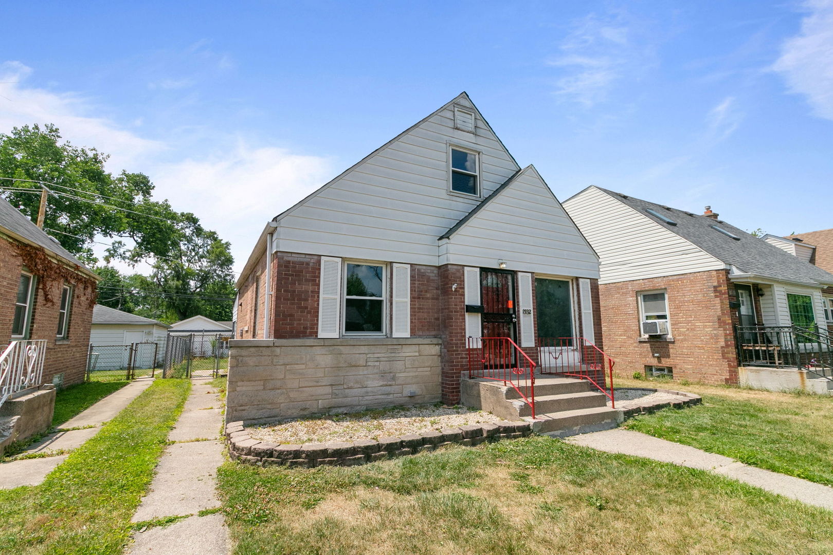 1532 State Line Road Calumet City, IL 60409 - Photo 2 of 15 a front view of house with a garden and sitting area