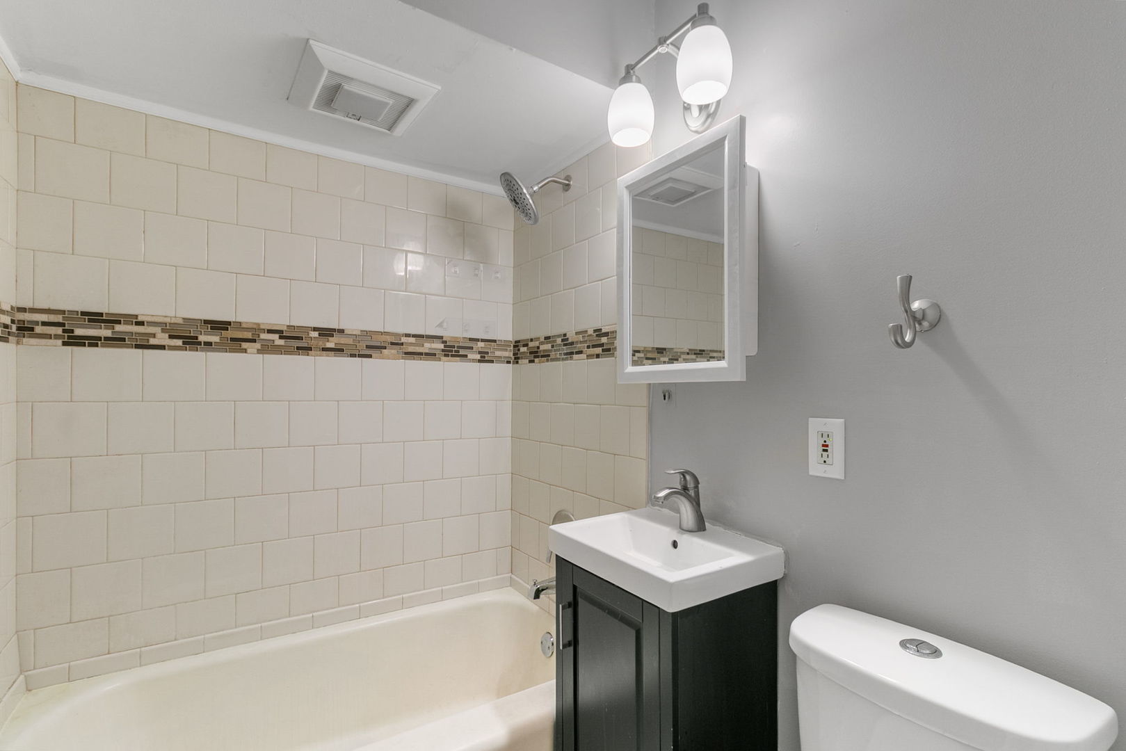 1532 State Line Road Calumet City, IL 60409 - Photo 6 of 15 a bathroom with a sink a toilet and shower