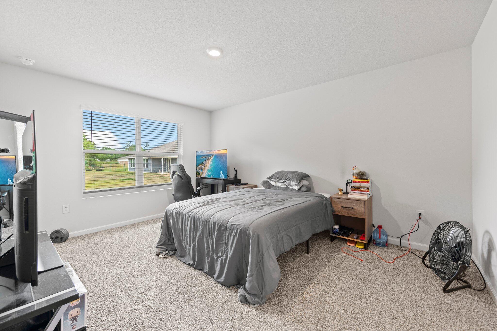 3107 Van Day Way Crestview, FL 32539 - Photo 26 of 38 a bedroom with a bed and a window