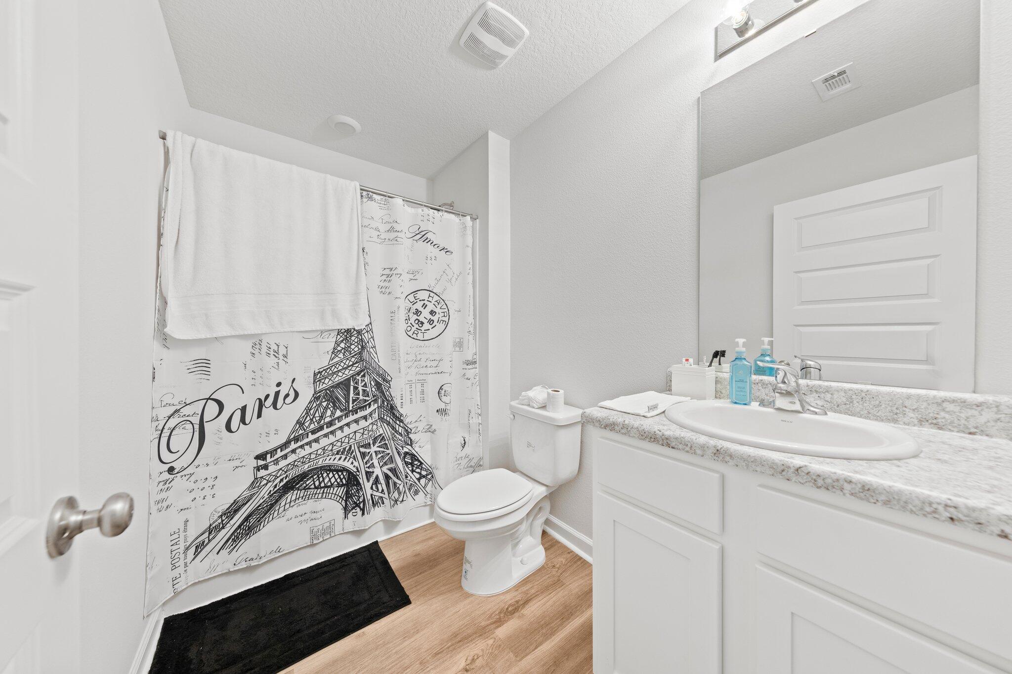 3107 Van Day Way Crestview, FL 32539 - Photo 8 of 38 a bathroom with a sink a toilet and a mirror