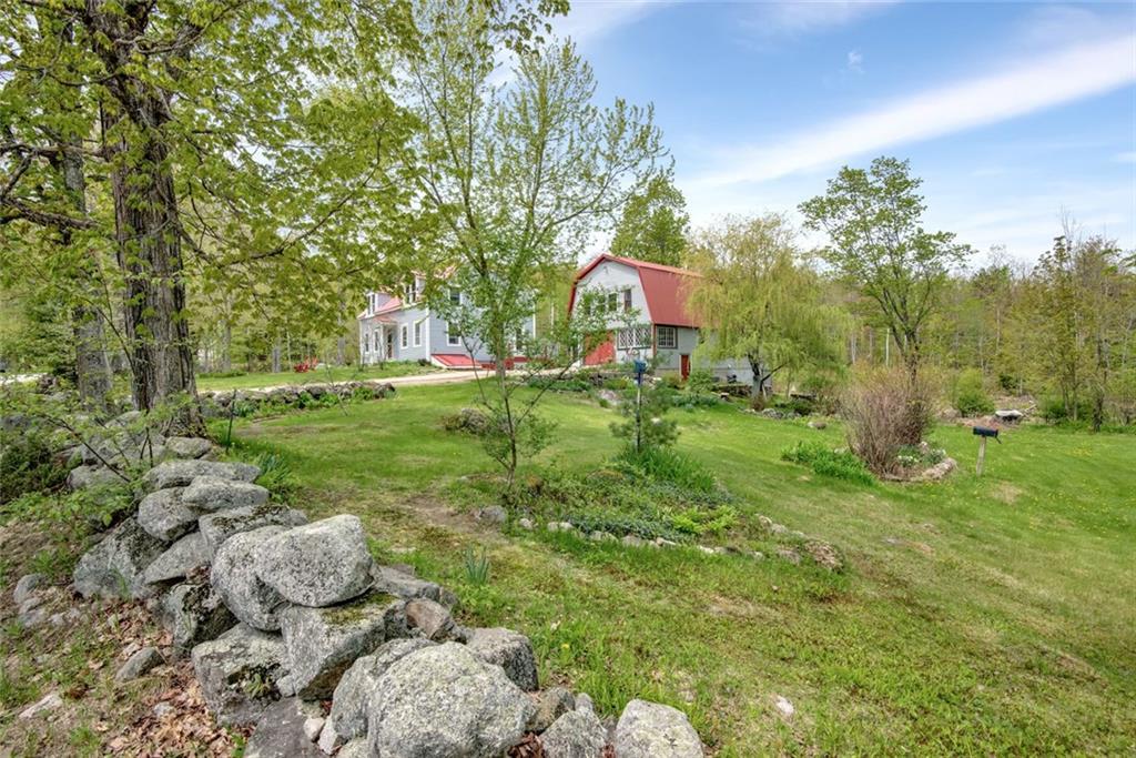 409 Lambs Mill Road Naples, ME 04055 - Photo 31 of 35 Pretty landscaping and rock wall.
