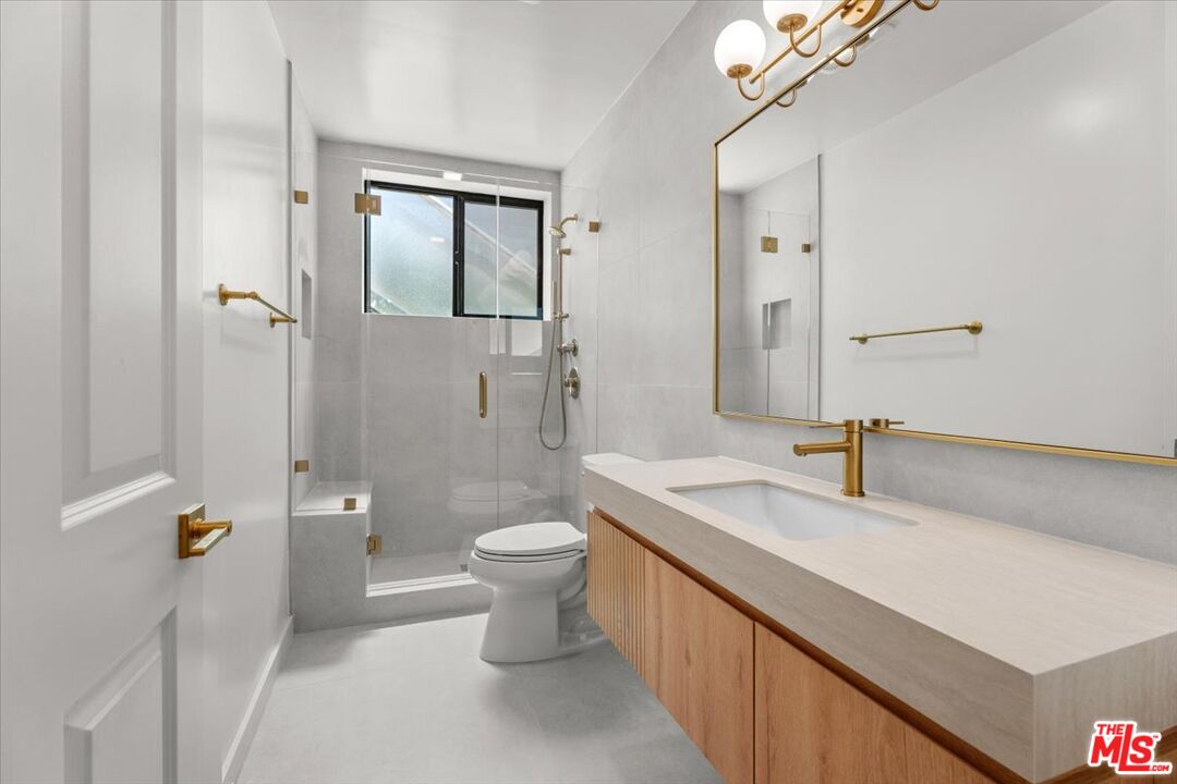 6732 Esplanade Street Playa del Rey, CA 90293 - Photo 4 of 10 a bathroom with a sink a toilet and shower