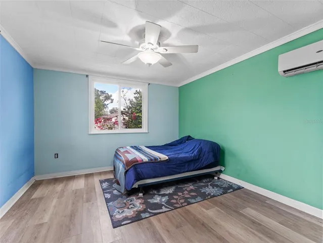 a living room with a bed furniture and a window