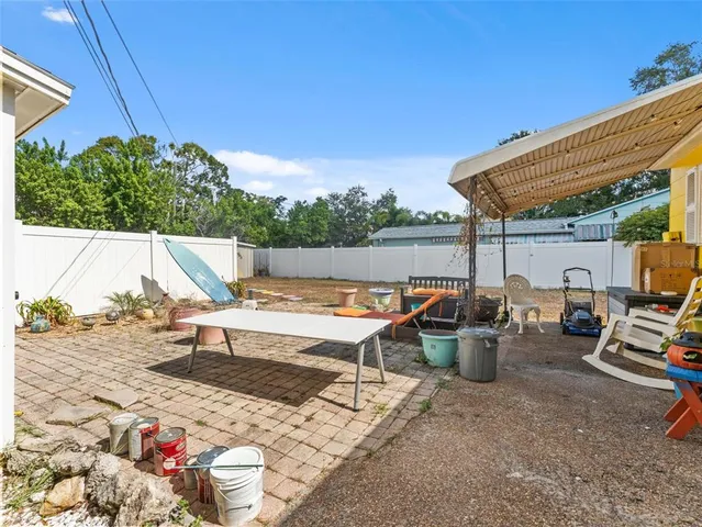 a view of a patio with couches and plants