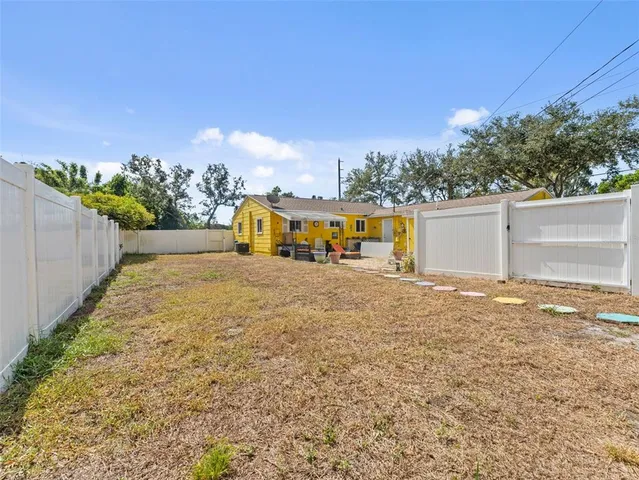 a view of a water fountain and a yard