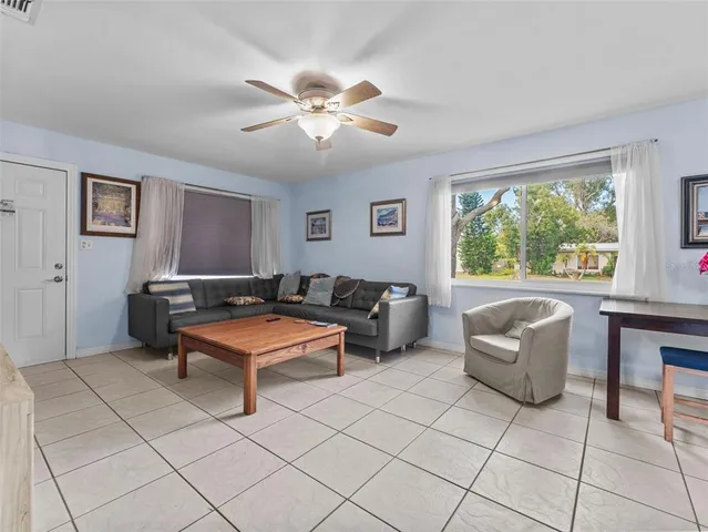 a living room with furniture and a window