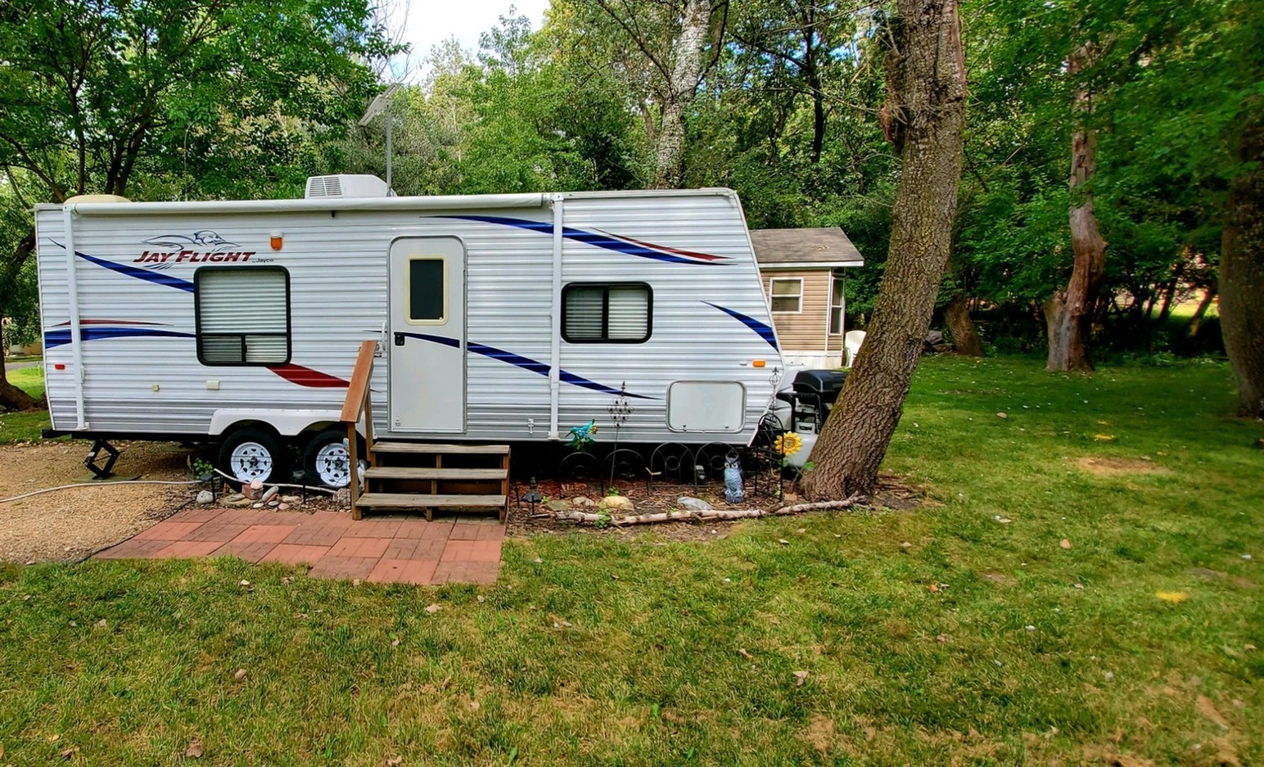 18-29 Woodhaven Lakes Sublette, IL 61367 - Photo 2 of 15 a view of a house with a yard