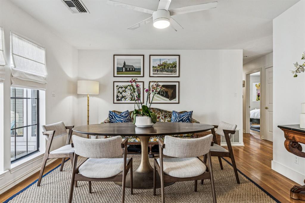 3635 Bryan Street Dallas, TX 75204 - Photo 20 of 40 a view of a dining room with furniture and wooden floor