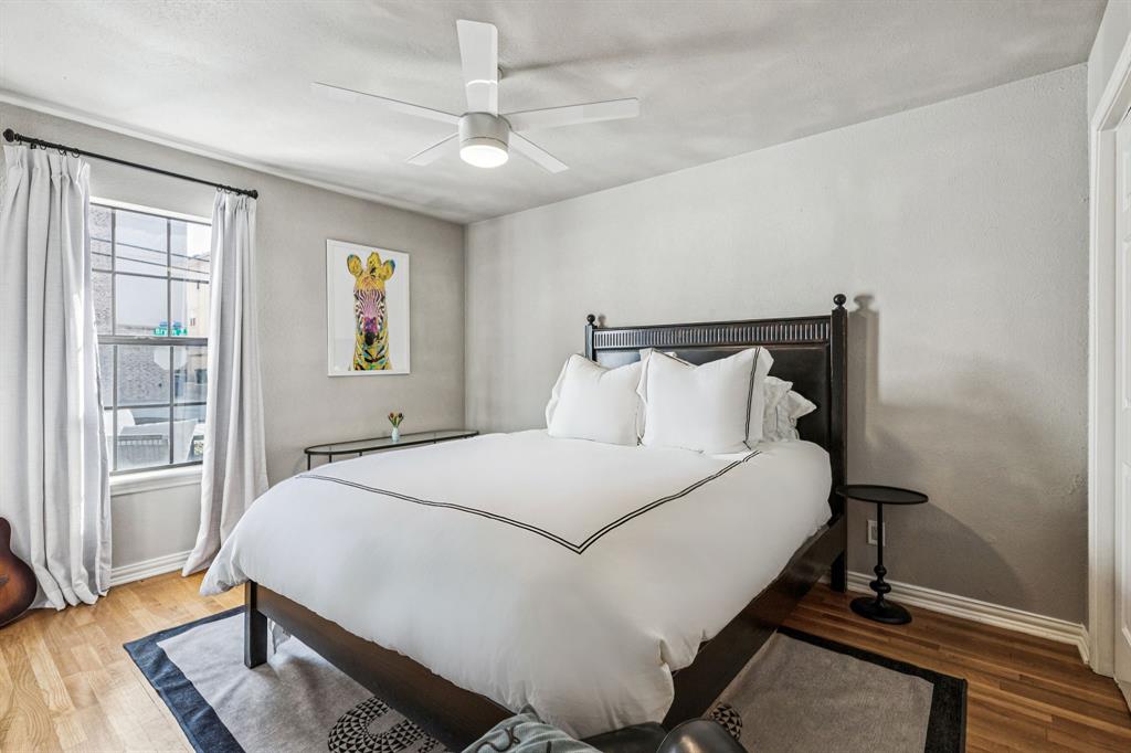 3635 Bryan Street Dallas, TX 75204 - Photo 29 of 40 a bedroom with a bed and wooden floor