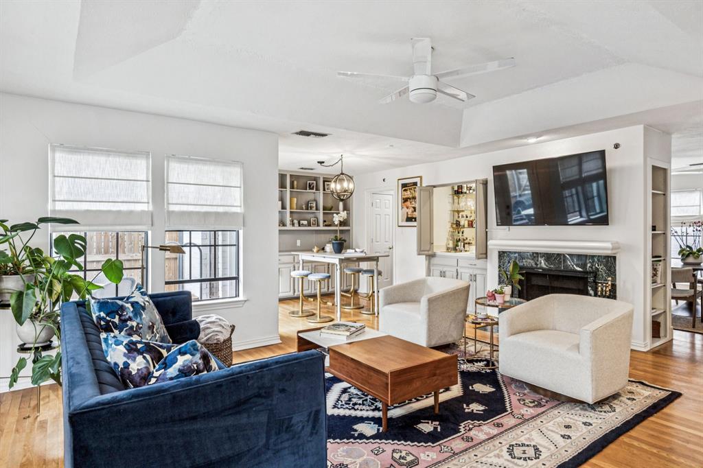 3635 Bryan Street Dallas, TX 75204 - Photo 7 of 40 a living room with furniture a fireplace and a flat screen tv