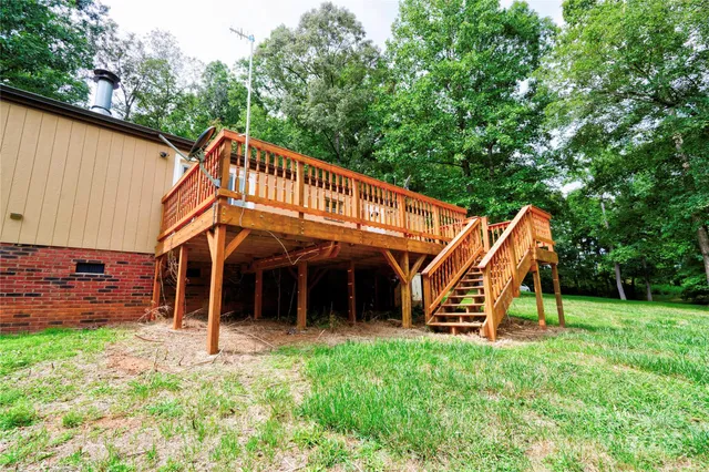 a view of a bedroom with a backyard and a slide