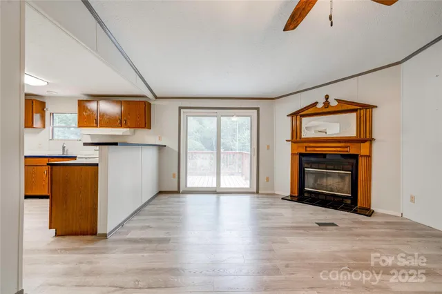 a view of kitchen with furniture and fireplace