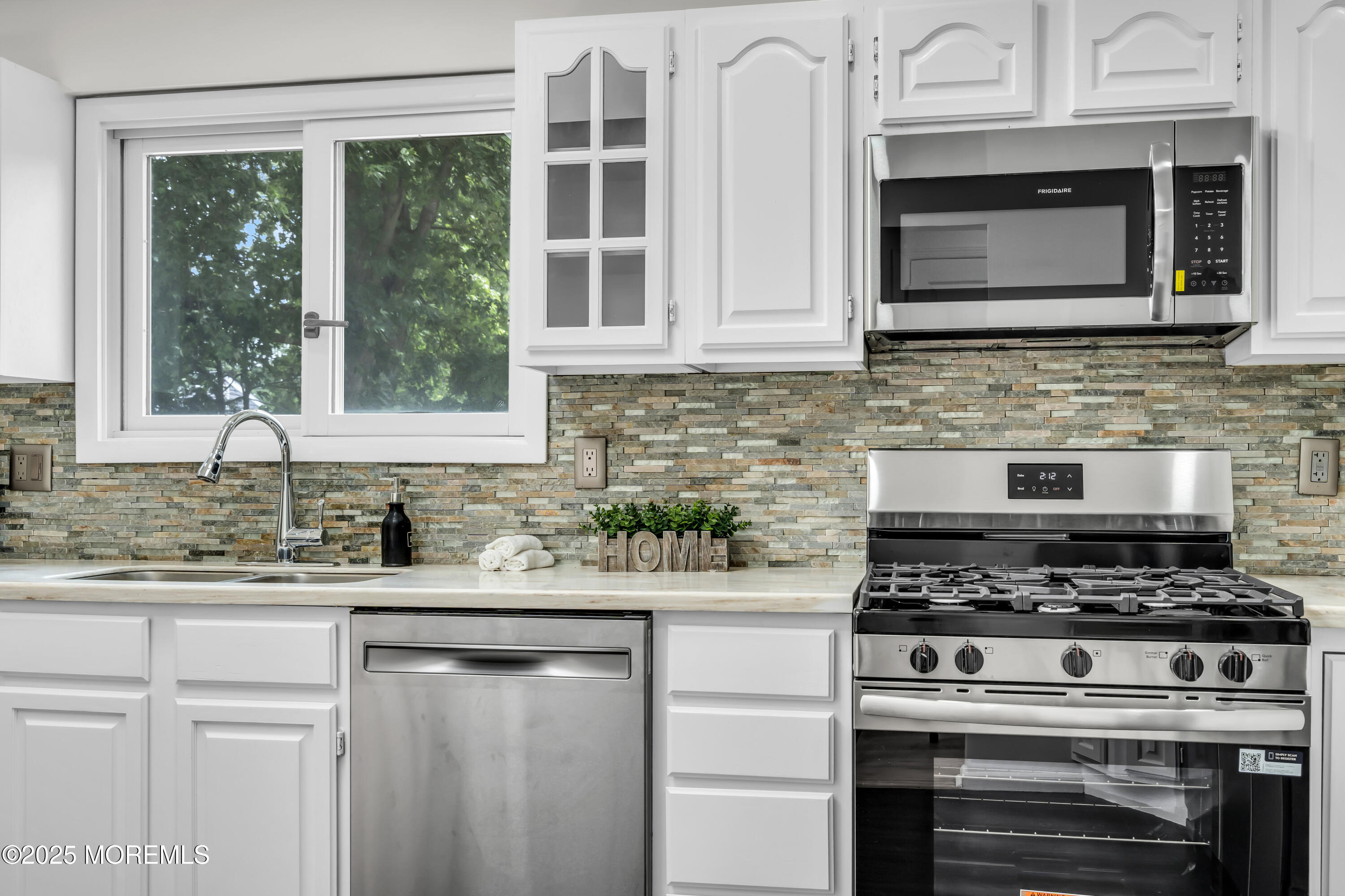 832 7th Avenue Toms River, NJ 08757 - Photo 13 of 31 a kitchen with stainless steel appliances granite countertop a stove and a sink