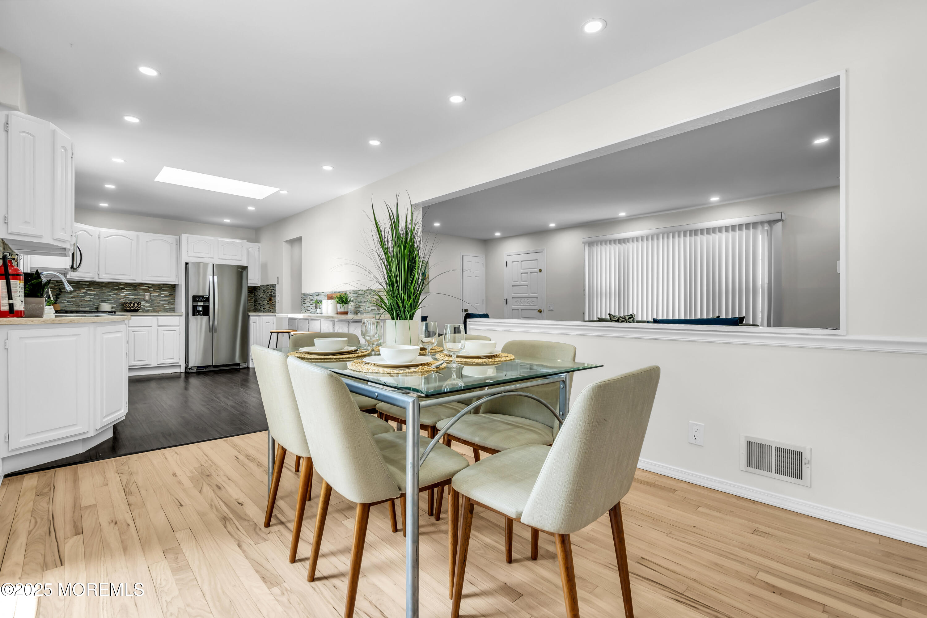 832 7th Avenue Toms River, NJ 08757 - Photo 16 of 31 a dining area with furniture and a wooden floor