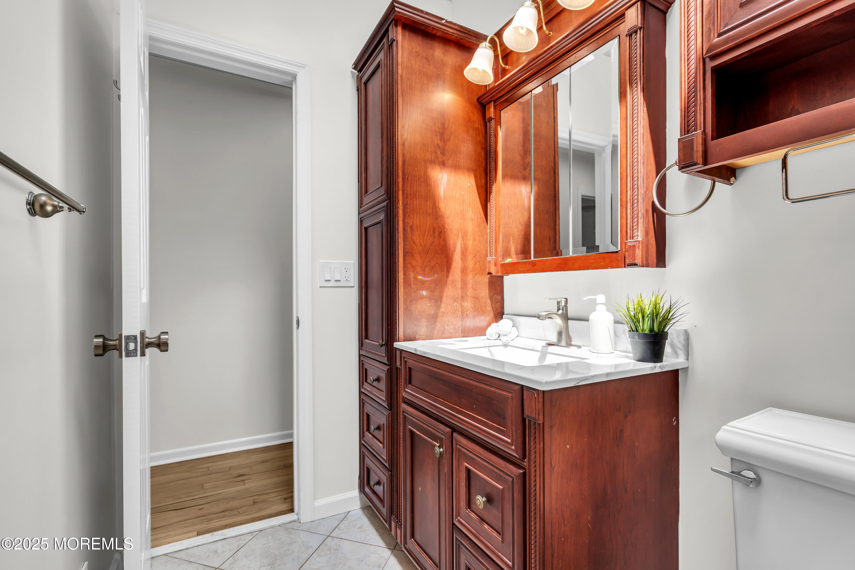 832 7th Avenue Toms River, NJ 08757 - Photo 19 of 31 a bathroom with a sink a vanity and a shower