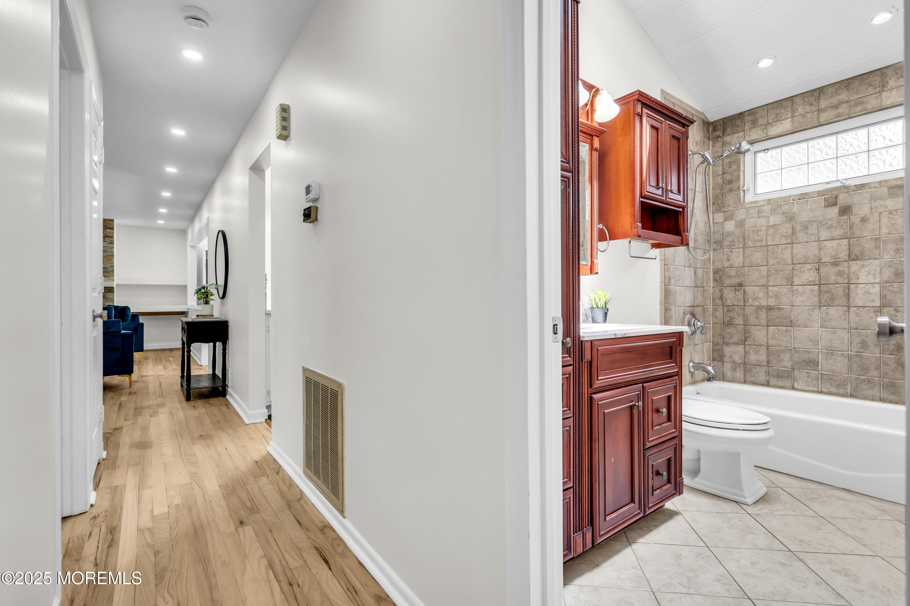 832 7th Avenue Toms River, NJ 08757 - Photo 20 of 31 a bathroom with a toilet sink and shower