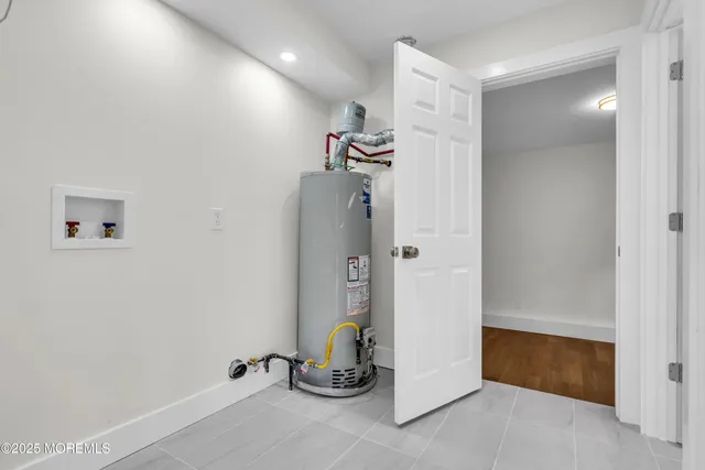 a room with gym equipment and mirror