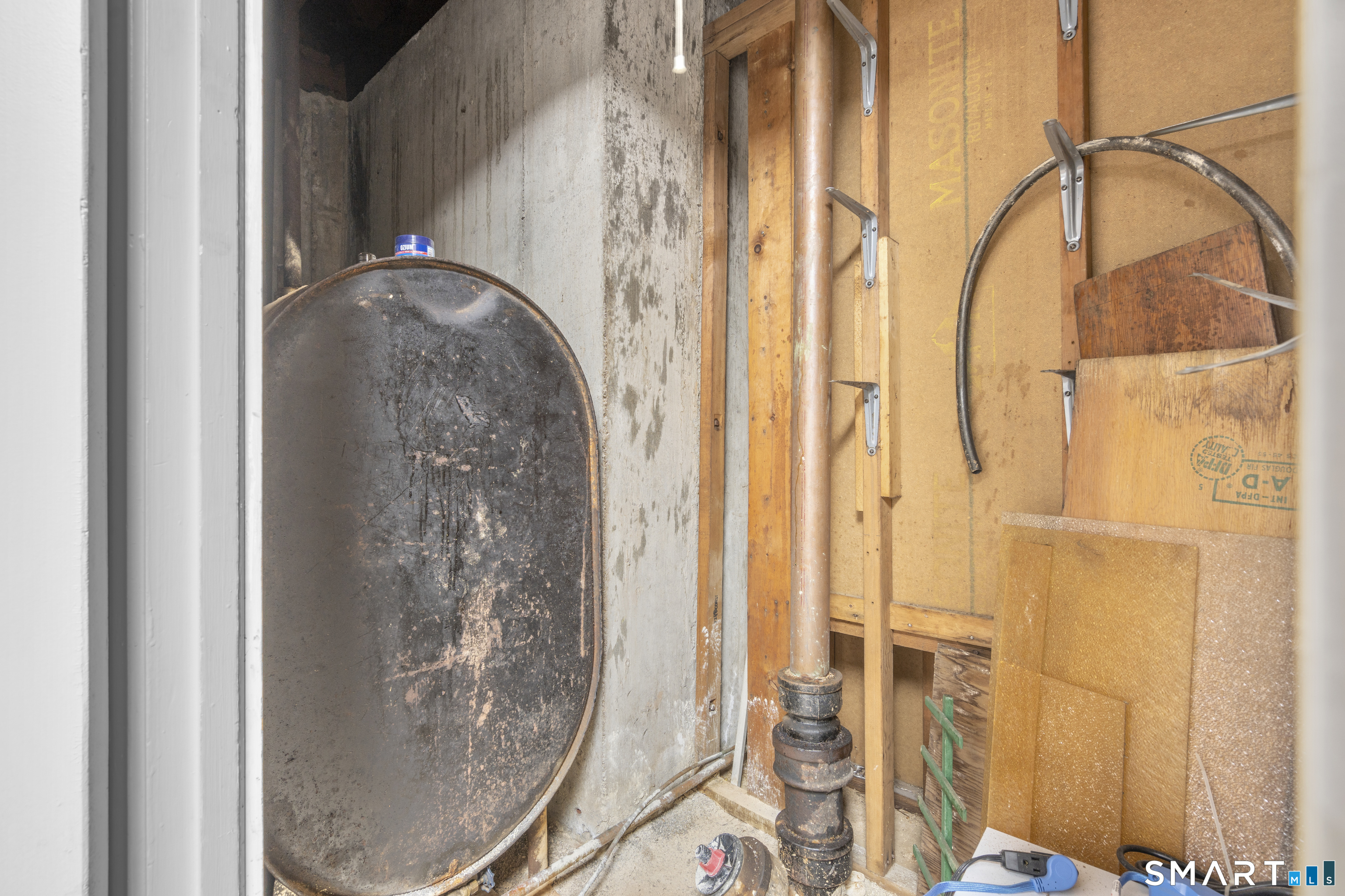 9 Daniel Road, Unit 9B Bristol, CT 06010 - Photo 12 of 16 a water heater on the side of a door