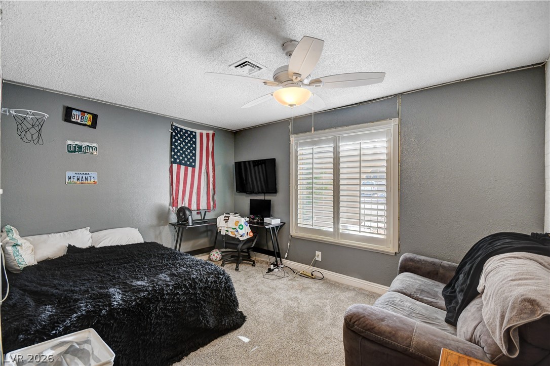 659 Arrayo Way Boulder City, NV 89005 - Photo 14 of 29 Plush wall-to-wall carpeting and clean baseboards ground this versatile secondary bedroom space.