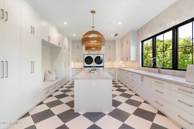 a room with a black white checkered floor with a black white checkered floor