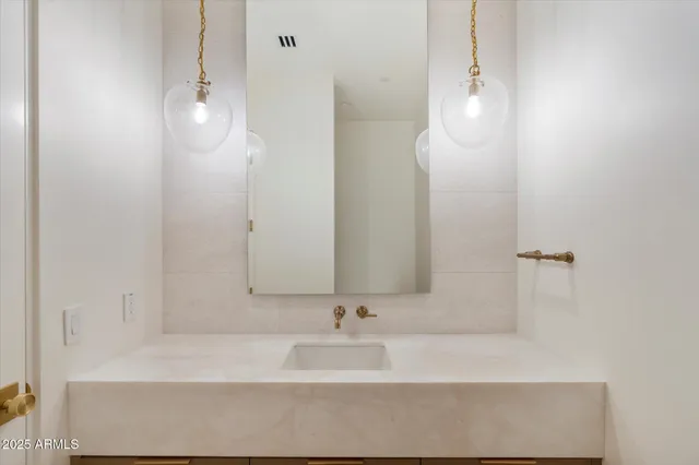 a view of a livingroom with furniture and floor to ceiling window