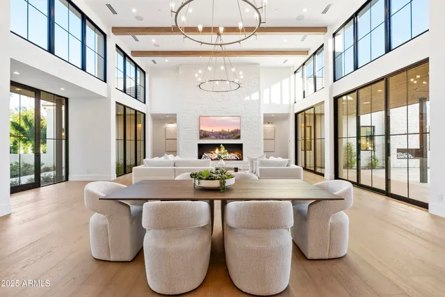 a view of an house with swimming pool and sitting area