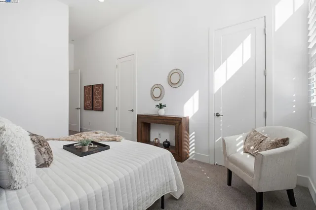 a bedroom with a bed and a fireplace