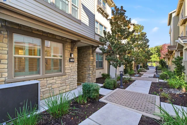 a view of house with backyard and garden