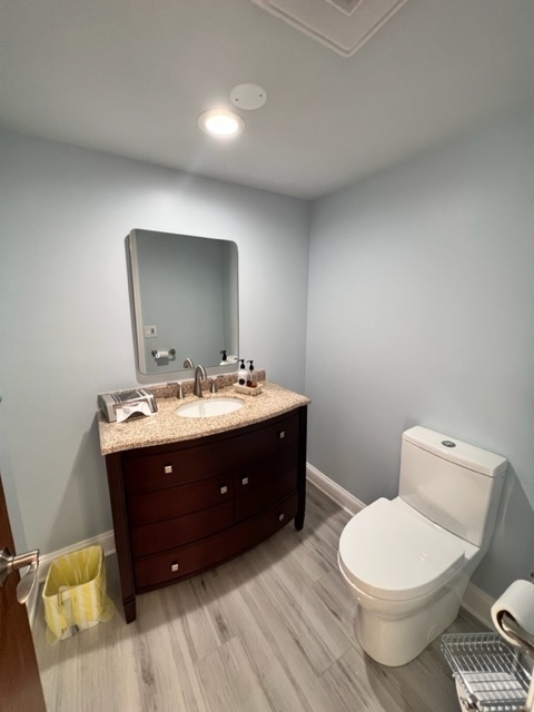 1006 North Delphia Avenue Park Ridge, IL 60068 - Photo 19 of 28 a bathroom with a toilet sink and mirror