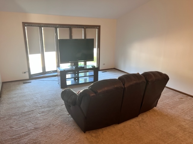 1006 North Delphia Avenue Park Ridge, IL 60068 - Photo 2 of 28 a living room with furniture and a floor to ceiling window