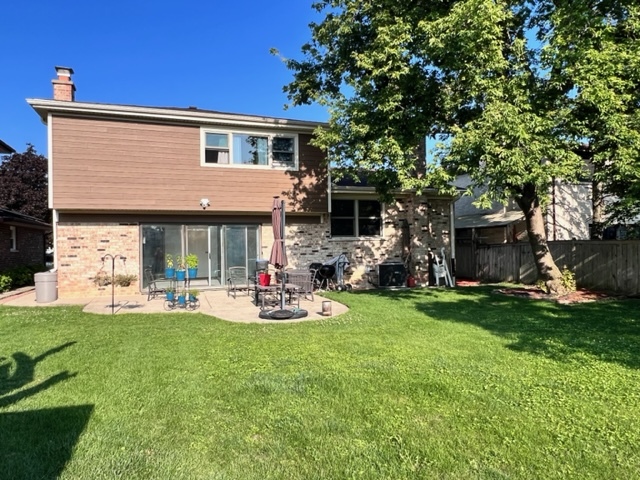 1006 North Delphia Avenue Park Ridge, IL 60068 - Photo 26 of 28 a front view of a house with patio and garden