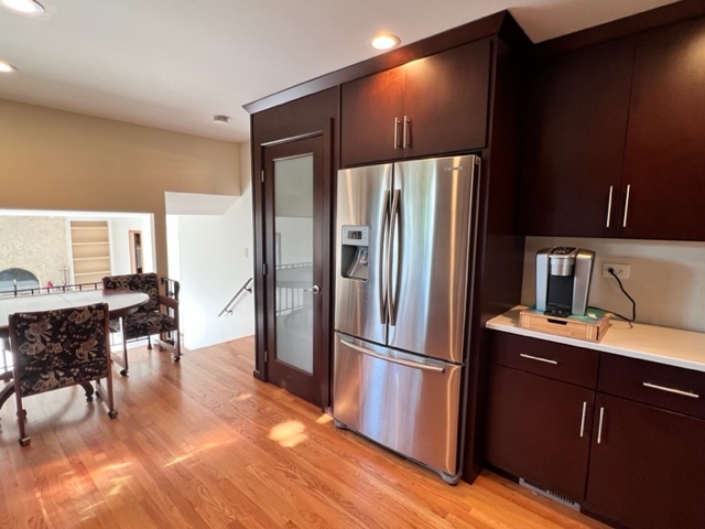 1006 North Delphia Avenue Park Ridge, IL 60068 - Photo 8 of 28 a kitchen with kitchen island a counter top space wooden floor and stainless steel appliances