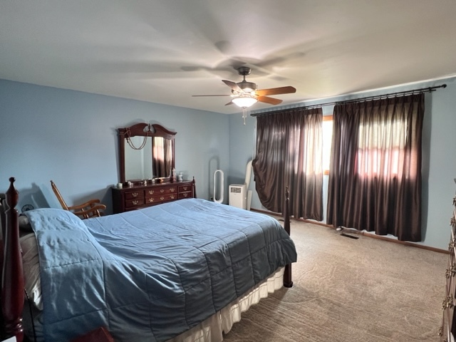 1006 North Delphia Avenue Park Ridge, IL 60068 - Photo 9 of 28 a bed sitting in a spacious bedroom next to a window