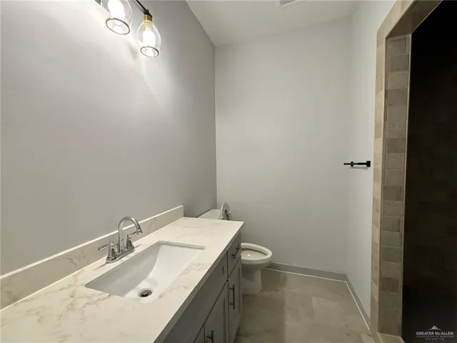 a bathroom with a sink and toilet