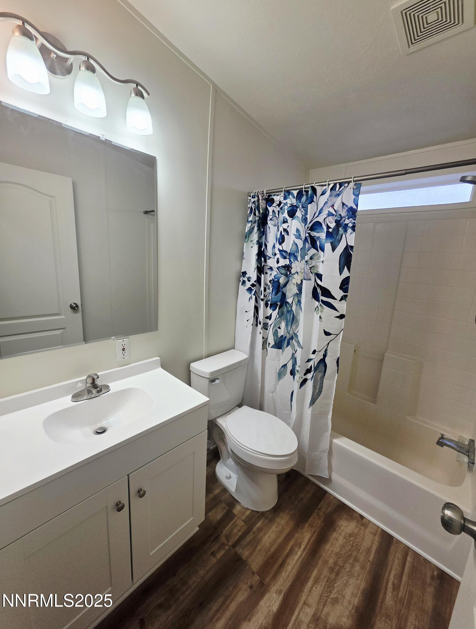 3146 Lone Tree Road Fallon, NV 89406 - Photo 19 of 23 a bathroom with a sink toilet a mirror and shower