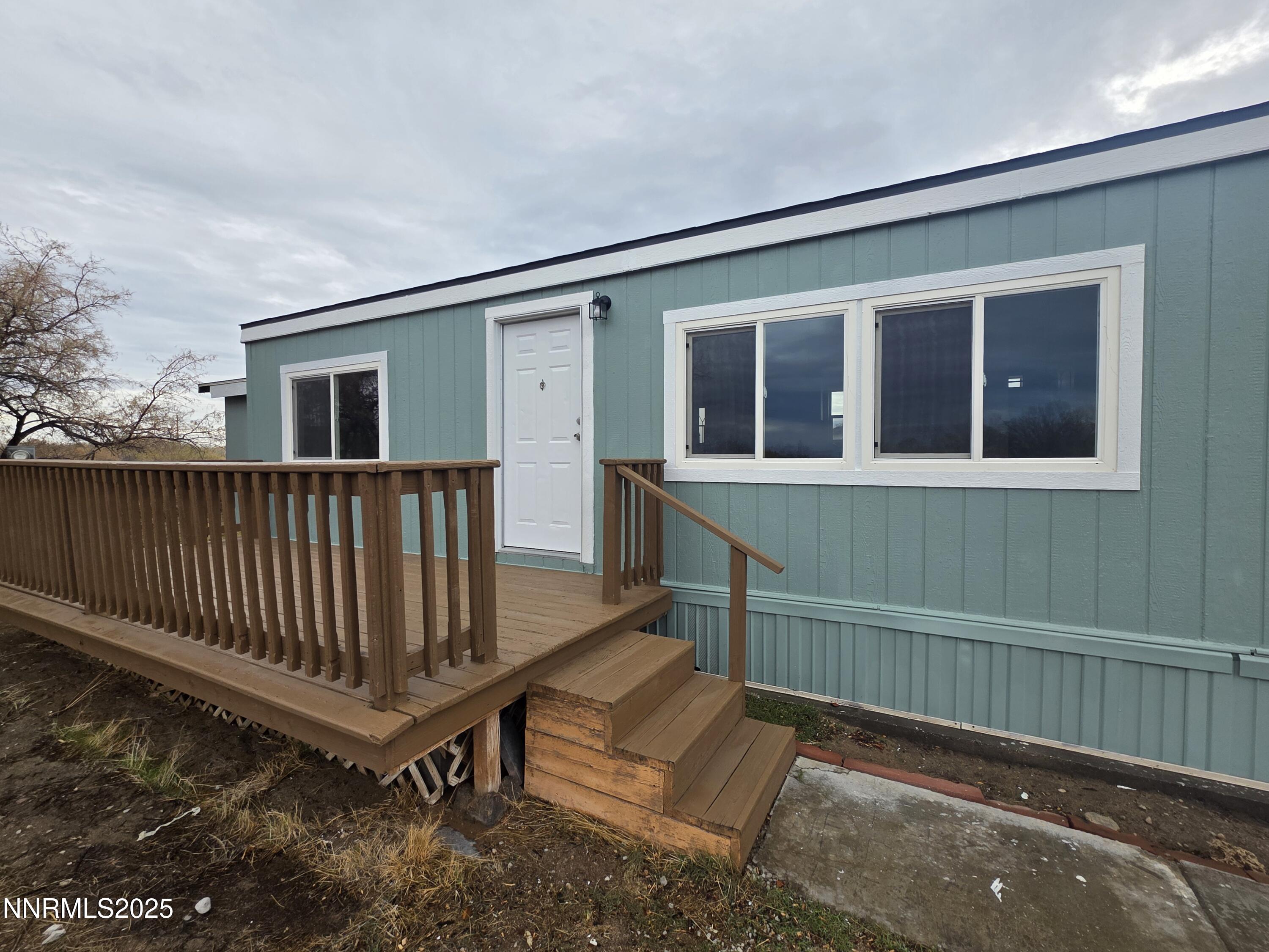 3146 Lone Tree Road Fallon, NV 89406 - Photo 2 of 23 a view of a house with wooden floor and a wooden fence