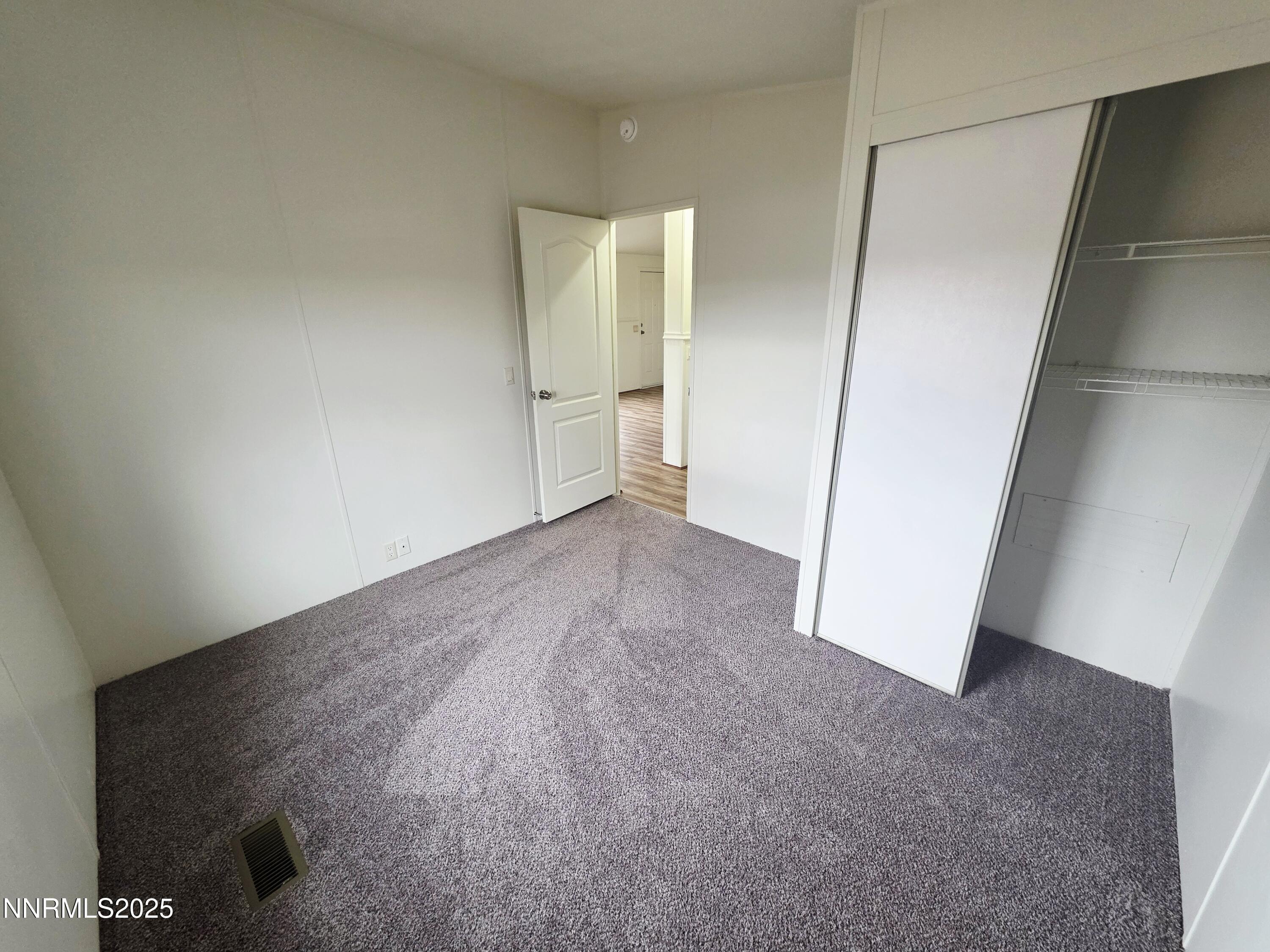 3146 Lone Tree Road Fallon, NV 89406 - Photo 21 of 23 an empty room with an entrance to other room