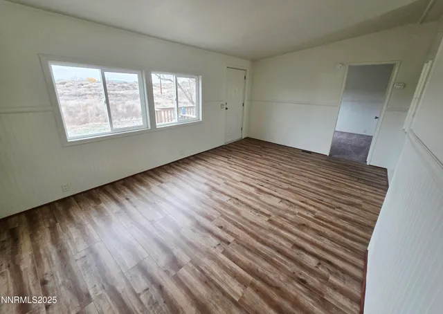 a view of an empty room and window