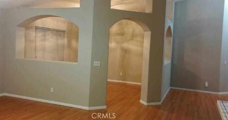 12858 Rain Shadow Road Victorville, CA 92395 - Photo 4 of 15 a view of livingroom with hardwood area