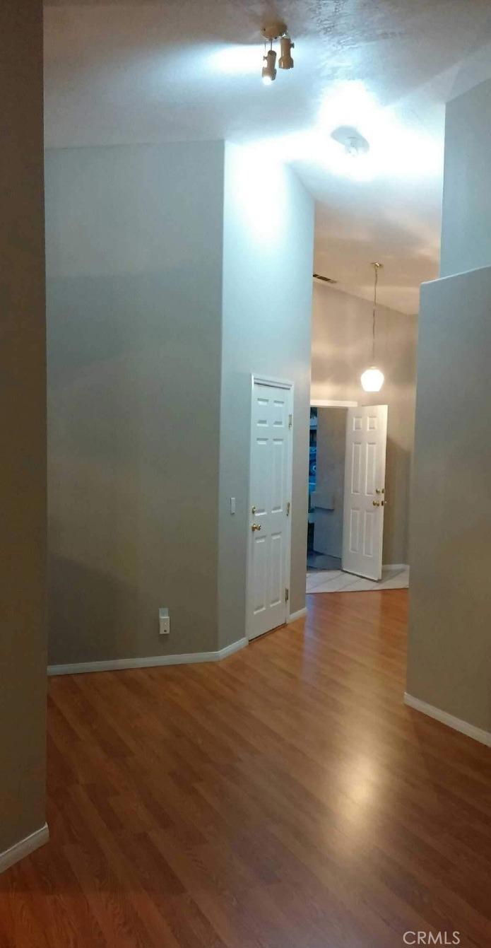 12858 Rain Shadow Road Victorville, CA 92395 - Photo 5 of 15 a view of a room with wooden floor