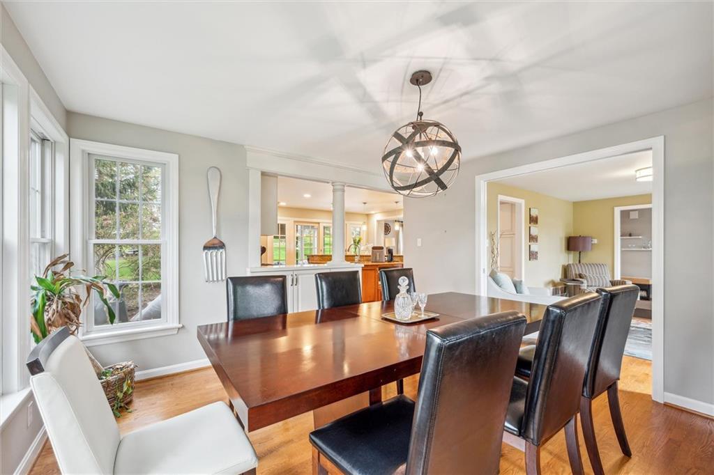 2336 Mill Grove Road Pittsburgh, PA 15241 - Photo 11 of 44 a view of a dining room with furniture a chandelier and wooden floor