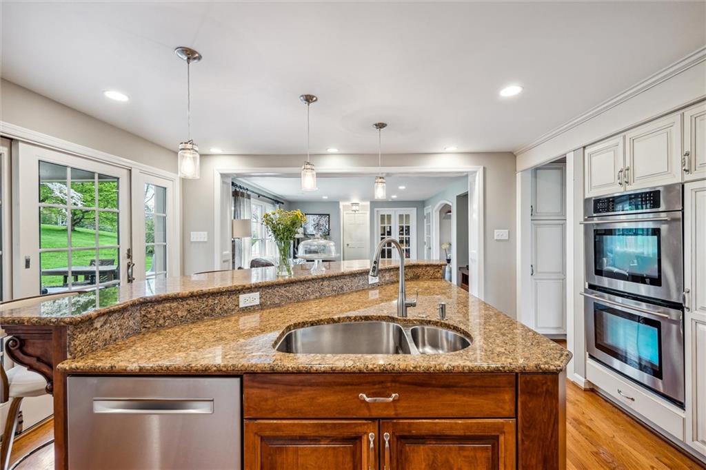 2336 Mill Grove Road Pittsburgh, PA 15241 - Photo 15 of 44 a kitchen with granite countertop a sink and center island